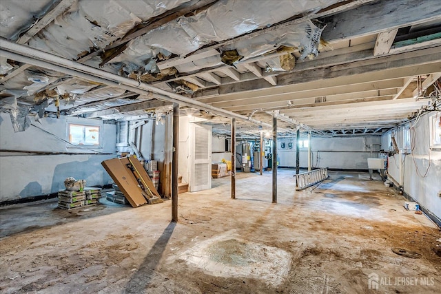 160 Academy St, South Orange Village, NJ 07079 - below grade area featuring water heater and a sink
