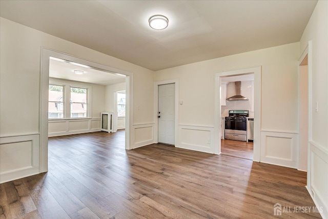160 Academy St, South Orange Village, NJ 07079 - unfurnished room with a decorative wall, wood finished floors, and wainscoting