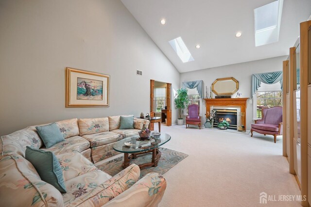 27 Dawson Ln, Monroe, NJ 08831 - living room with a skylight, high vaulted ceiling, carpet, a glass covered fireplace, and recessed lighting