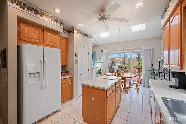 27 Dawson Ln, Monroe, NJ 08831 - kitchen featuring white fridge with ice dispenser, a skylight, a ceiling fan, light countertops, and a center island