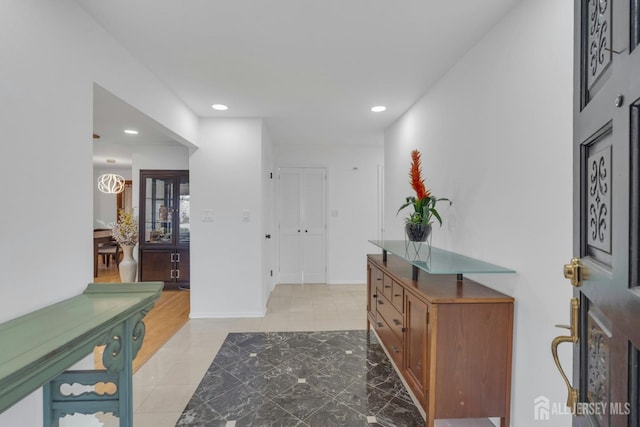entryway featuring light tile patterned floors and recessed lighting