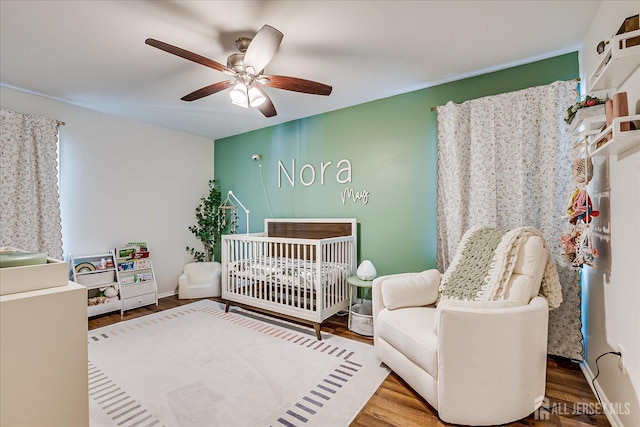 16 Rachele Ct, Old Bridge, NJ 07747 - bedroom featuring a crib, wood finished floors, and a ceiling fan