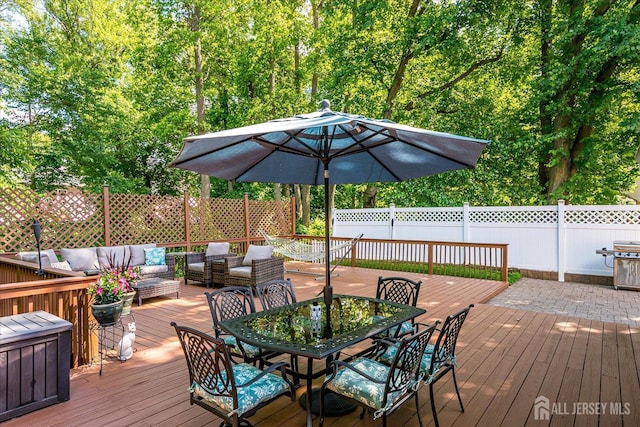 16 Rachele Ct, Old Bridge, NJ 07747 - wooden deck with an outdoor hangout area, outdoor dining space, and a grill