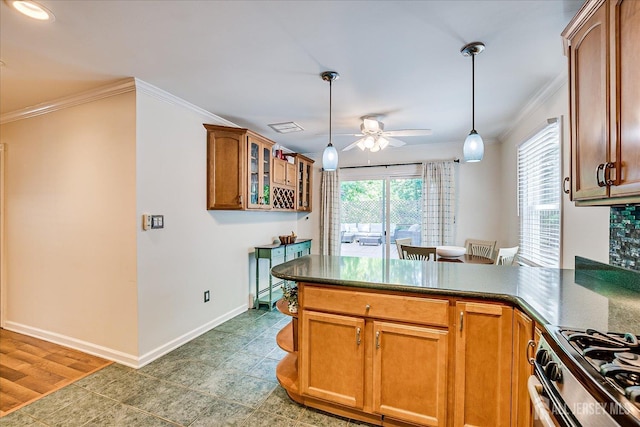 16 Rachele Ct, Old Bridge, NJ 07747 - kitchen featuring ornamental molding, a ceiling fan, a peninsula, gas range, and hanging light fixtures