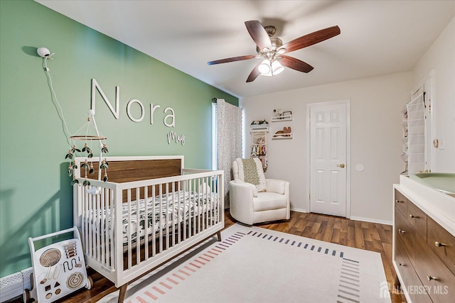 16 Rachele Ct, Old Bridge, NJ 07747 - bedroom featuring a crib, wood finished floors, ceiling fan, and baseboards