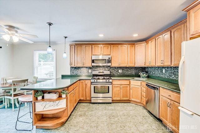 16 Rachele Ct, Old Bridge, NJ 07747 - kitchen with appliances with stainless steel finishes, open shelves, a sink, a peninsula, and decorative backsplash