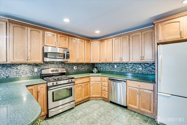 16 Rachele Ct, Old Bridge, NJ 07747 - kitchen with stainless steel appliances, decorative backsplash, recessed lighting, light brown cabinetry, and a sink