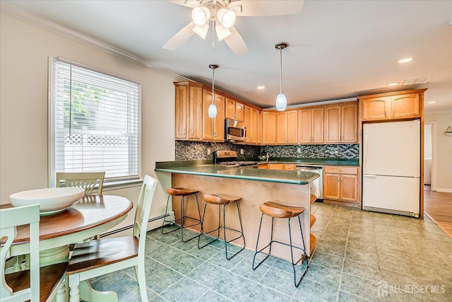 16 Rachele Ct, Old Bridge, NJ 07747 - kitchen featuring stainless steel appliances, dark countertops, a peninsula, decorative backsplash, and ornamental molding