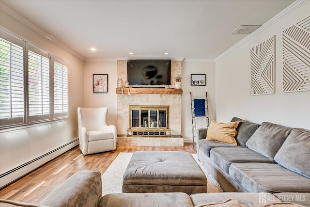 16 Rachele Ct, Old Bridge, NJ 07747 - living room with a baseboard heating unit, wood finished floors, ornamental molding, a fireplace, and recessed lighting