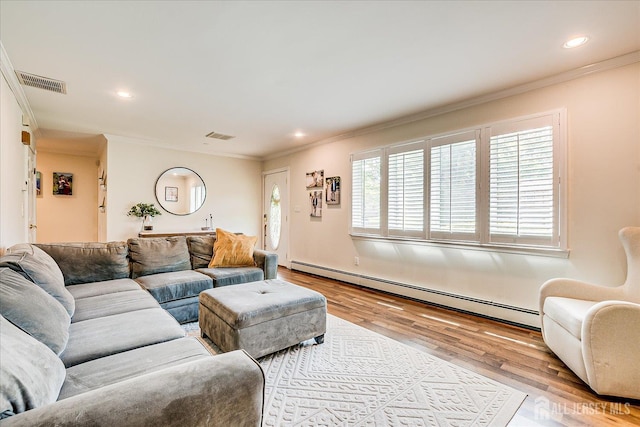 16 Rachele Ct, Old Bridge, NJ 07747 - living area featuring a baseboard heating unit, wood finished floors, ornamental molding, and recessed lighting
