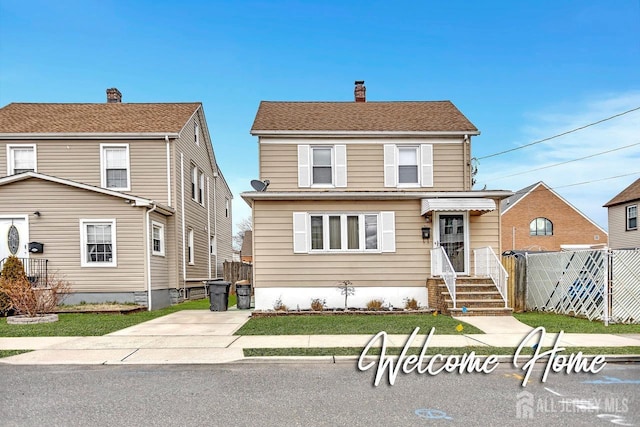 view of front of home featuring a gate, fence, and a chimney