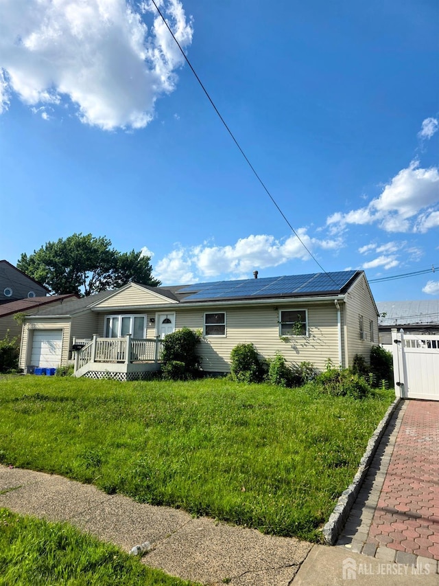 41 Harrison Ave, Carteret, NJ 07008 - single story home featuring an attached garage, a front yard, and a deck