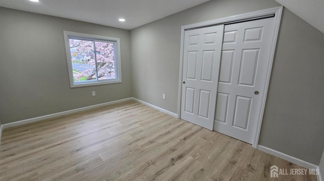 1150 Rahway Ave, Avenel, NJ 07001 - unfurnished bedroom featuring wood finished floors, recessed lighting, a closet, and baseboards