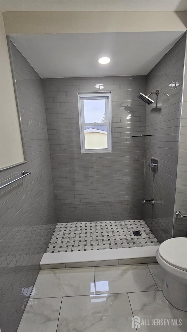 1150 Rahway Ave, Avenel, NJ 07001 - bathroom with marble look tiles, toilet, a tile shower, and recessed lighting