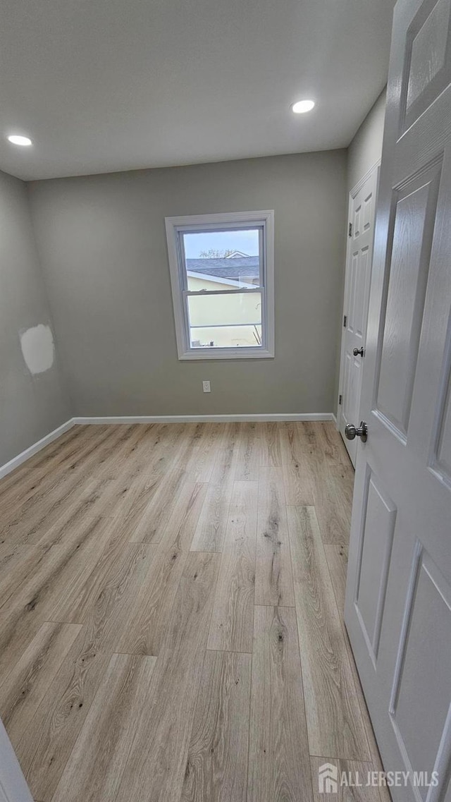 1150 Rahway Ave, Avenel, NJ 07001 - spare room featuring wood finished floors, baseboards, and recessed lighting