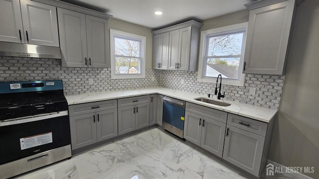 1150 Rahway Ave, Avenel, NJ 07001 - kitchen featuring appliances with stainless steel finishes, gray cabinets, under cabinet range hood, a sink, and recessed lighting