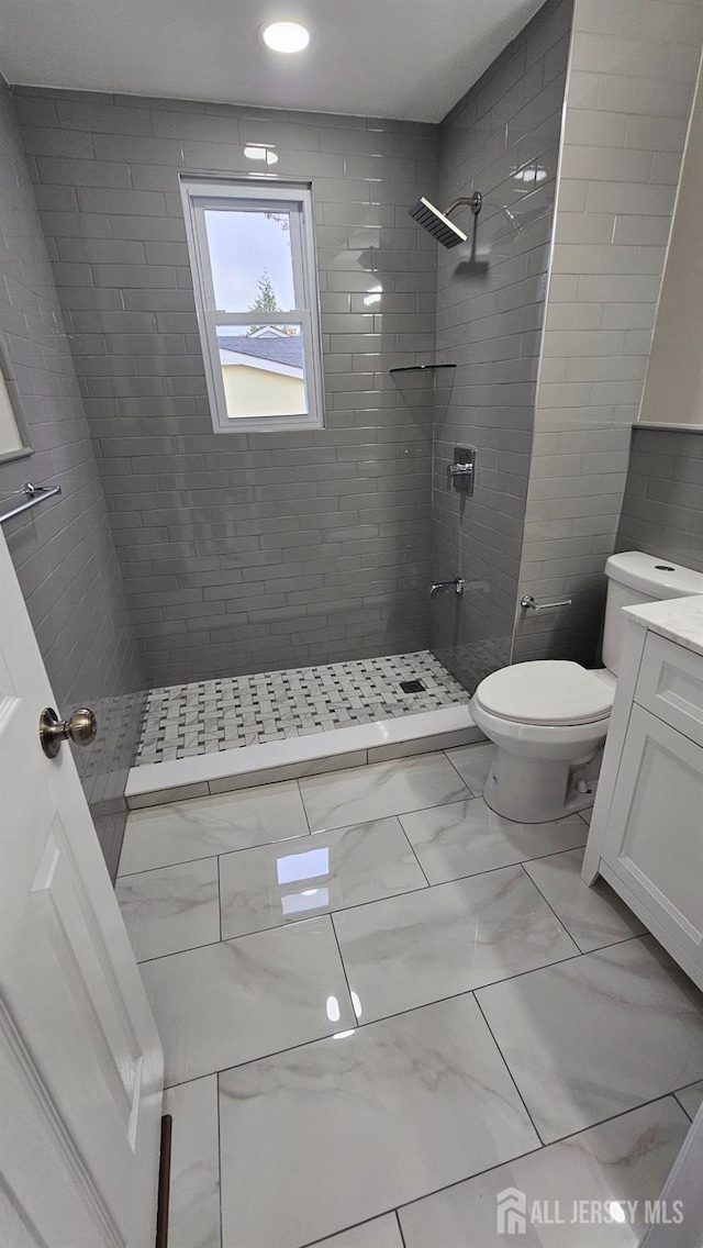 1150 Rahway Ave, Avenel, NJ 07001 - full bath featuring marble finish floors, toilet, vanity, tiled shower, and recessed lighting