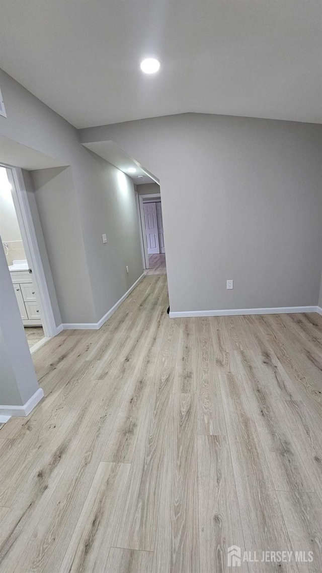 1150 Rahway Ave, Avenel, NJ 07001 - unfurnished living room with baseboards, light wood-style flooring, and recessed lighting