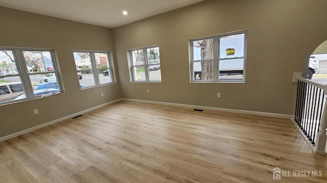1150 Rahway Ave, Avenel, NJ 07001 - unfurnished room with light wood-style floors, arched walkways, baseboards, and recessed lighting