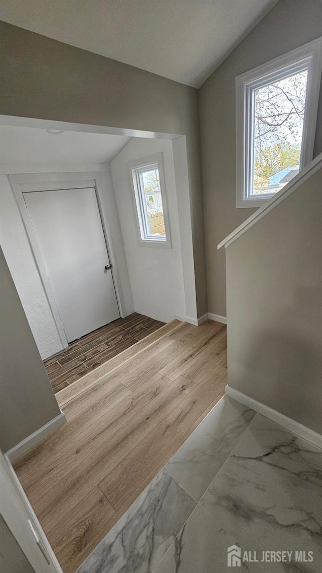 1150 Rahway Ave, Avenel, NJ 07001 - foyer entrance with vaulted ceiling, baseboards, and marble look tiles