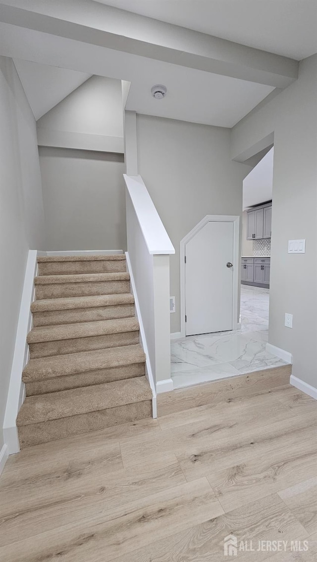 1150 Rahway Ave, Avenel, NJ 07001 - stairway featuring baseboards and wood finished floors