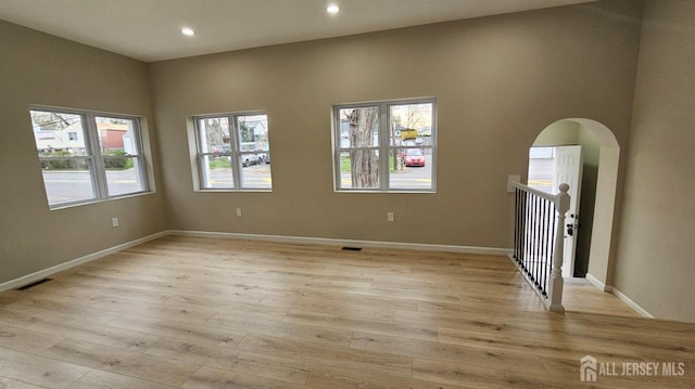 1150 Rahway Ave, Avenel, NJ 07001 - unfurnished room with light wood-style floors, recessed lighting, baseboards, and arched walkways