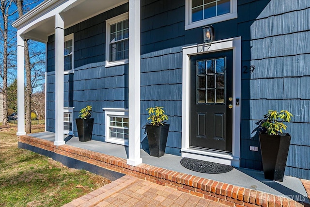 doorway to property with covered porch