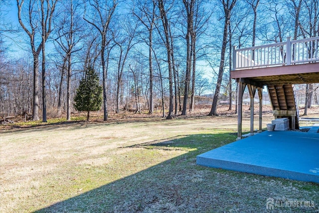 view of yard with stairway and a deck
