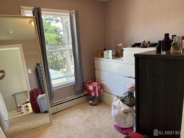 carpeted bedroom with baseboard heating