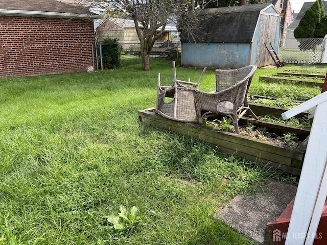 22 State St, Carteret, NJ 07008 - view of yard with a storage shed, a garden, and an outbuilding
