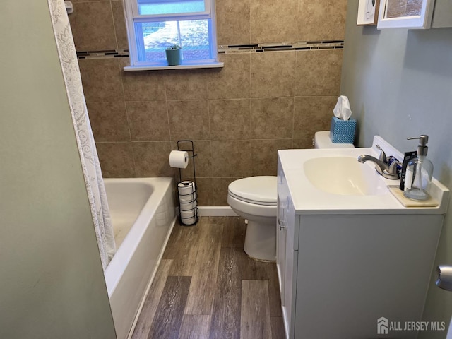 full bathroom featuring vanity, wood-type flooring, shower / bath combo, and toilet