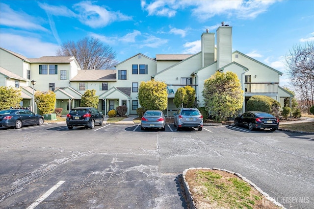 uncovered parking lot with a residential view