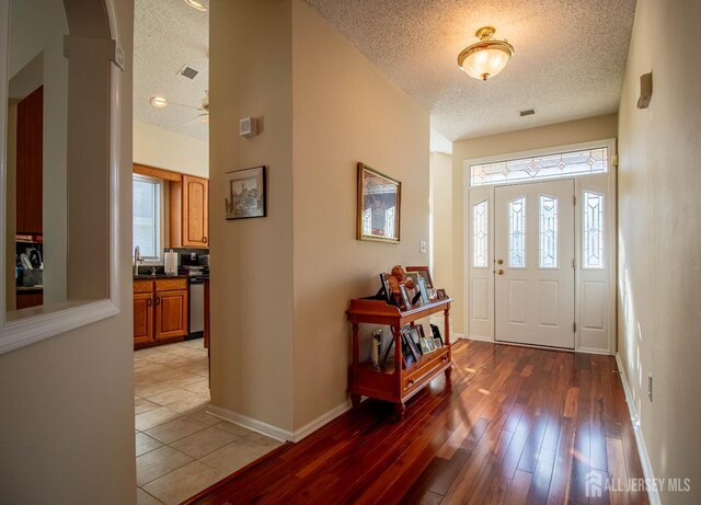 136 Chichester Rd, Monroe, NJ 08831 - entrance foyer featuring a textured ceiling, light wood-style floors, and baseboards