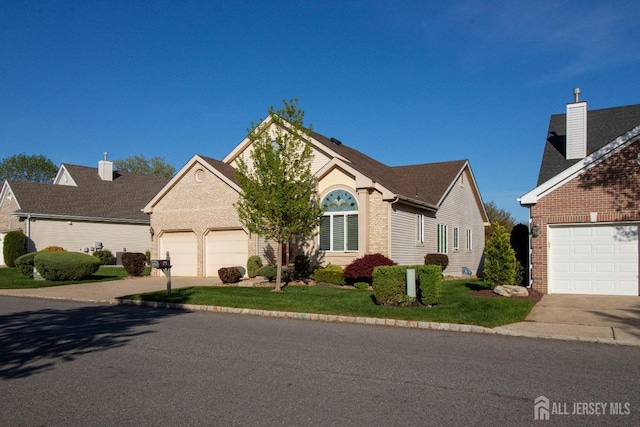 136 Chichester Rd, Monroe, NJ 08831 - view of front facade with driveway, brick siding, a garage, and a front yard