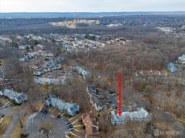 bird's eye view featuring a forest view