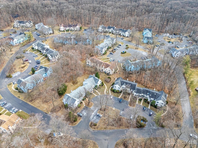 birds eye view of property with a residential view and a view of trees