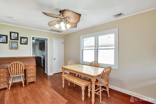 274 Prospect Ave, South Amboy, NJ 08879 - dining space with a ceiling fan, crown molding, wood finished floors, and baseboards