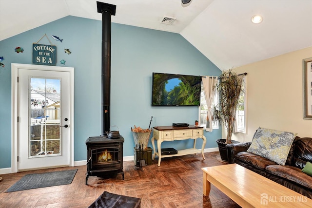 274 Prospect Ave, South Amboy, NJ 08879 - living area featuring a wood stove, vaulted ceiling, baseboards, and recessed lighting