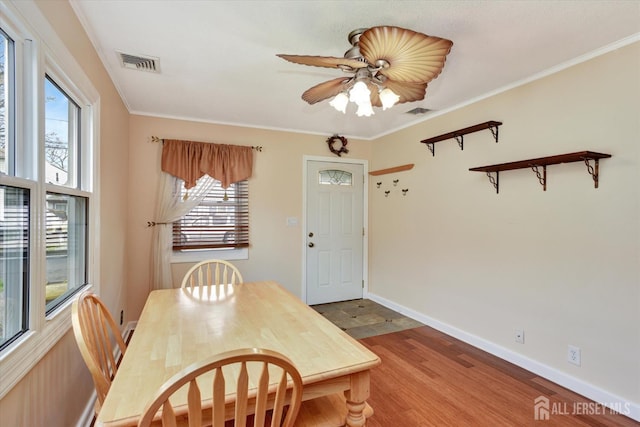 274 Prospect Ave, South Amboy, NJ 08879 - dining room featuring plenty of natural light, wood finished floors, ceiling fan, ornamental molding, and baseboards