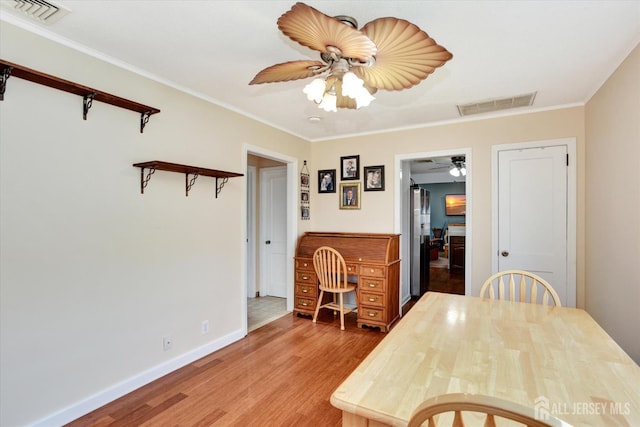 274 Prospect Ave, South Amboy, NJ 08879 - dining room with a ceiling fan, light wood-style flooring, ornamental molding, and baseboards