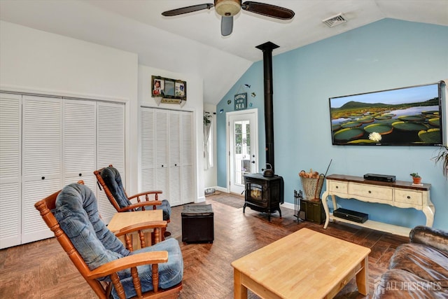 274 Prospect Ave, South Amboy, NJ 08879 - living room featuring a wood stove, lofted ceiling, ceiling fan, and baseboards