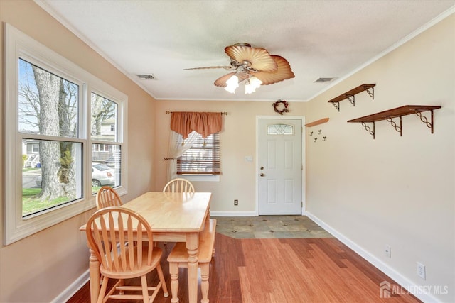 274 Prospect Ave, South Amboy, NJ 08879 - dining space featuring wood finished floors, baseboards, a ceiling fan, and crown molding