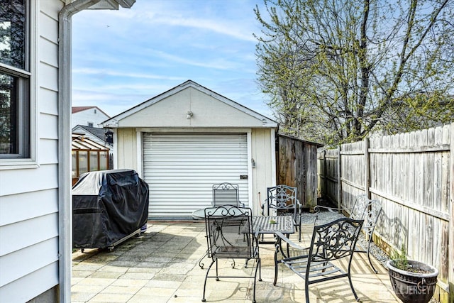 274 Prospect Ave, South Amboy, NJ 08879 - fenced backyard featuring outdoor dining area, a patio, an outbuilding, and area for grilling