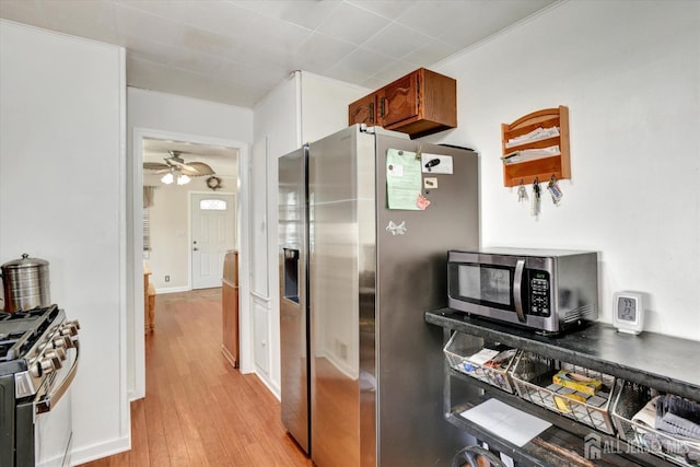 274 Prospect Ave, South Amboy, NJ 08879 - kitchen with appliances with stainless steel finishes, light wood-style flooring, and ceiling fan