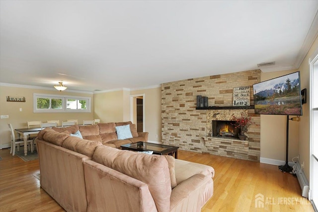 44 Lakeside Dr S, Piscataway, NJ 08854 - living area with crown molding, a fireplace, light wood-style flooring, and baseboards