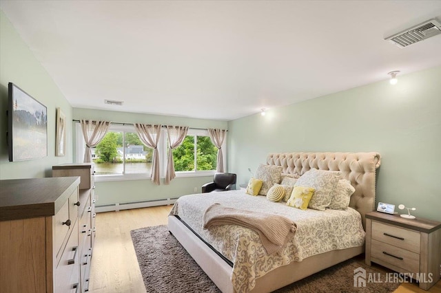 44 Lakeside Dr S, Piscataway, NJ 08854 - bedroom featuring baseboard heating and light wood-type flooring