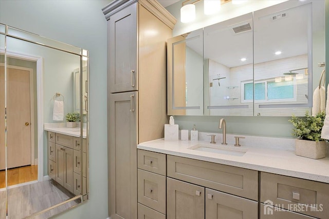 44 Lakeside Dr S, Piscataway, NJ 08854 - full bath featuring vanity, tiled shower, and wood finished floors