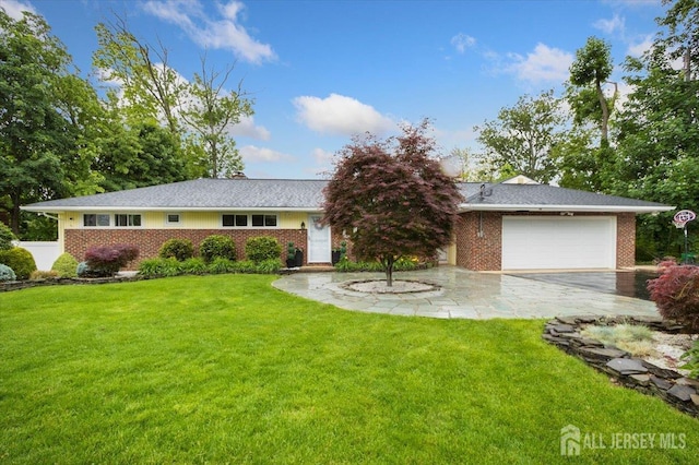 44 Lakeside Dr S, Piscataway, NJ 08854 - view of front of home with brick siding, a garage, a front yard, and driveway