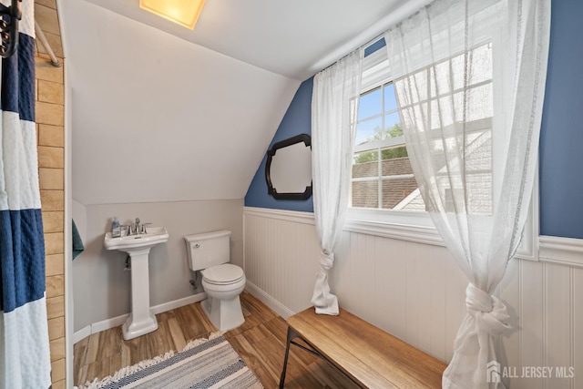 6 Linda Ave, Colonia, NJ 07067 - bathroom with lofted ceiling, a wainscoted wall, and wood finished floors