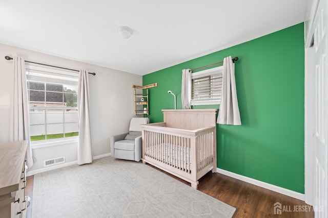 6 Linda Ave, Colonia, NJ 07067 - bedroom with a nursery area and wood finished floors